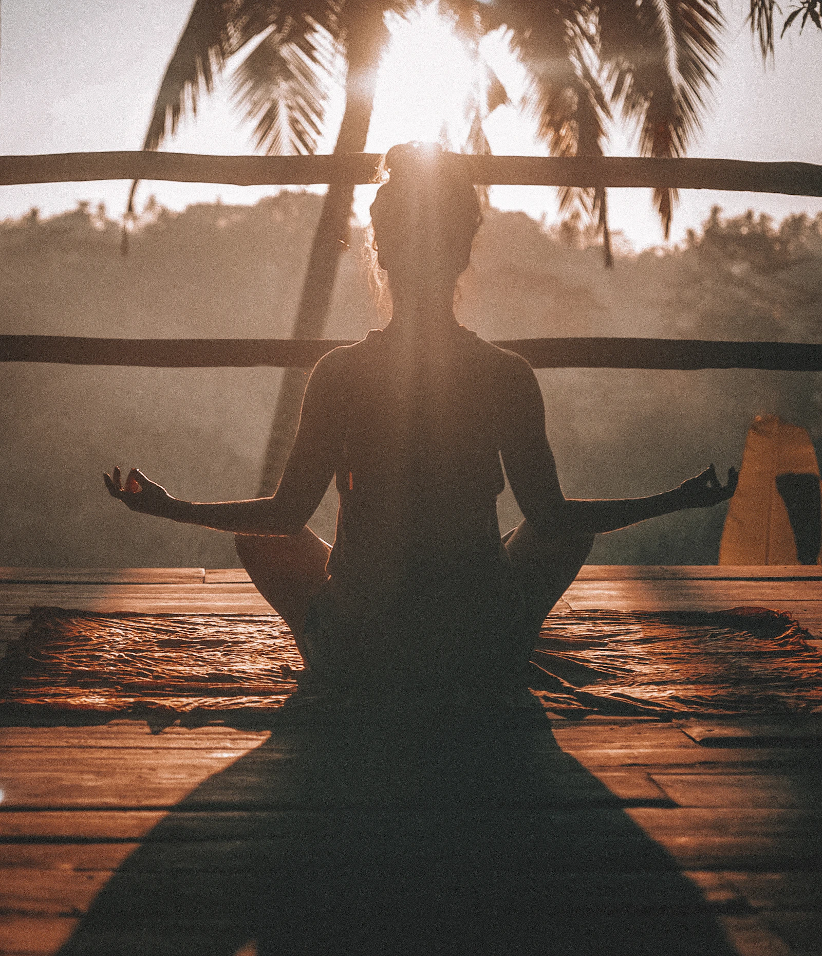 A person in a quiet moment of practice, soft morning light
